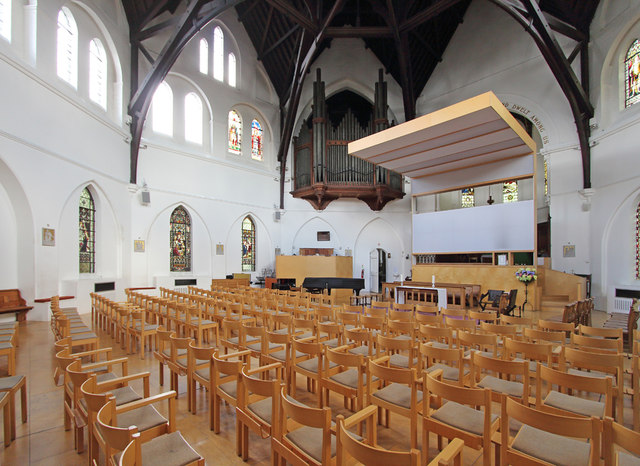 Wooden chairs and a bright interior at All Souls, Harlesden